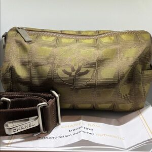 Chanel New Travel Line Mini Roll or Barrel Bag in a khaki or olive green color